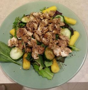 Chicken, spring mix salad, yellow carrots, cucumber with balsamic dressing. 